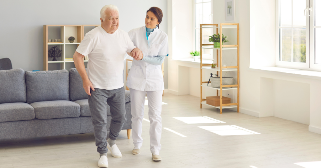 Older man walking with therapist